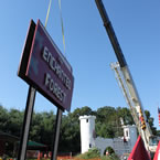 Putting new sign into place for the Enchanted Forest